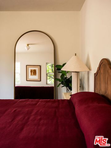 a bathroom with a sink a window and a mirror