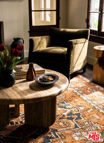 a living room with furniture and a lamp