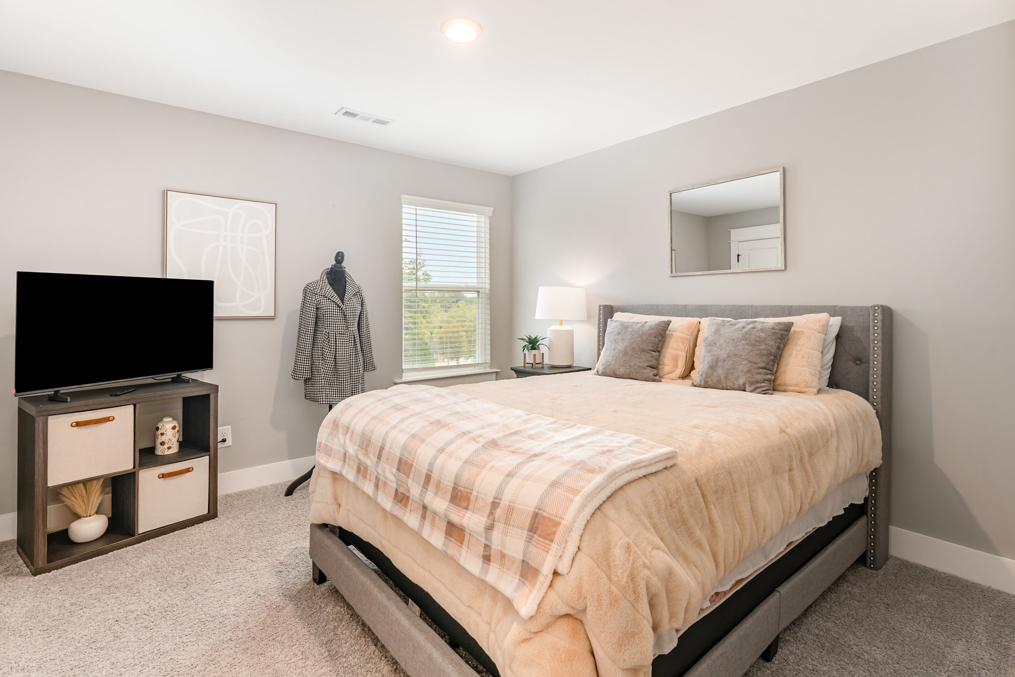 203 Caroline Way Mount Juliet, TN 37122 - Photo 28 of 37 a spacious bedroom with a bed and a flat screen tv