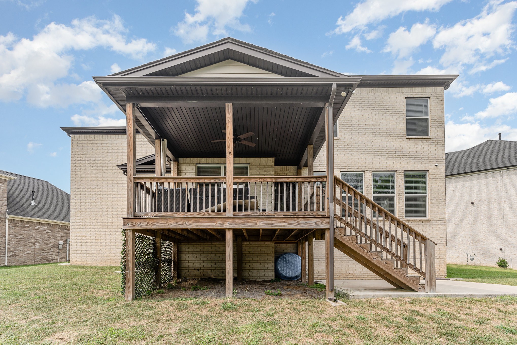 203 Caroline Way Mount Juliet, TN 37122 - Photo 32 of 37 a view of a house with a deck and a yard