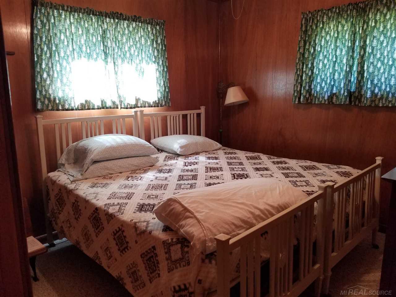 7464 Shoreward Road Lexington, MI 48450 - Photo 10 of 31 King-sized bed fits in this room