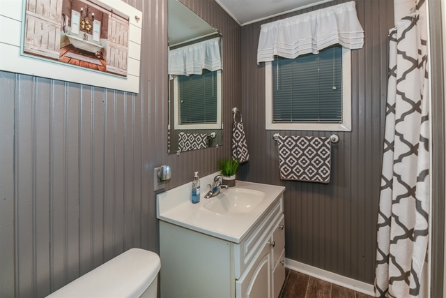10818 Austin Avenue Chicago Ridge, IL 60415 - Photo 11 of 16 a bathroom with a sink toilet and shower
