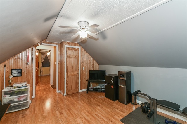 10818 Austin Avenue Chicago Ridge, IL 60415 - Photo 13 of 16 a view of a workspace with furniture and wooden floor