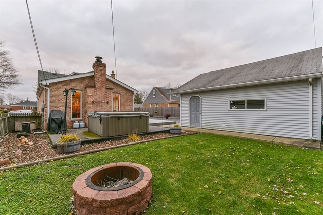10818 Austin Avenue Chicago Ridge, IL 60415 - Photo 15 of 16 a view of a house with a sink and a yard