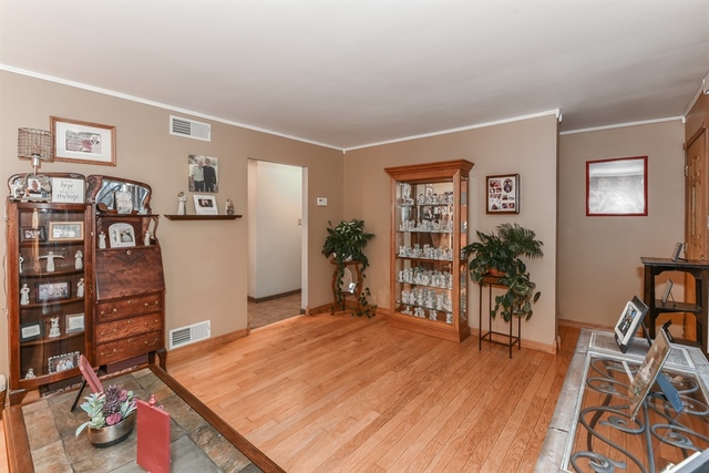 10818 Austin Avenue Chicago Ridge, IL 60415 - Photo 3 of 16 a living room with furniture and wooden floor