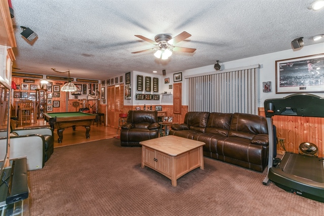 10818 Austin Avenue Chicago Ridge, IL 60415 - Photo 8 of 16 a living room with furniture and a chandelier