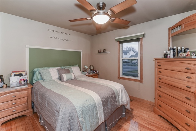 10818 Austin Avenue Chicago Ridge, IL 60415 - Photo 10 of 16 a bedroom with a bed and a dresser