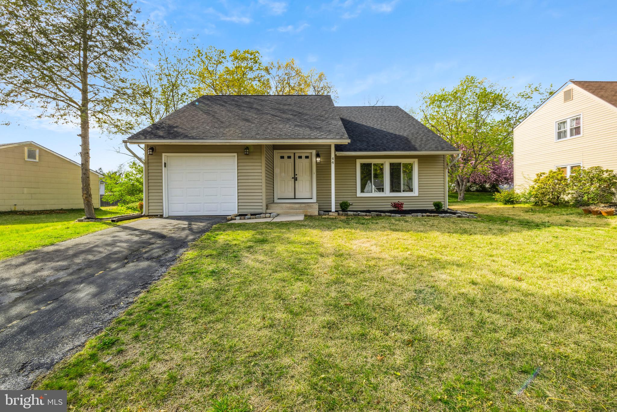 a view of a house with garden and yard
