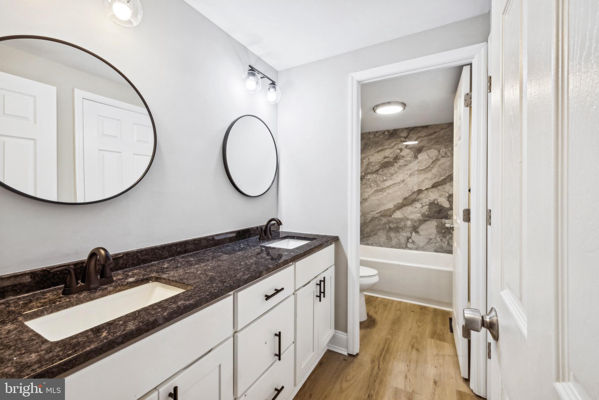 44 Pershing Lane Sicklerville, NJ 08081 - Photo 11 of 24 a bathroom with a granite countertop sink mirror and vanity