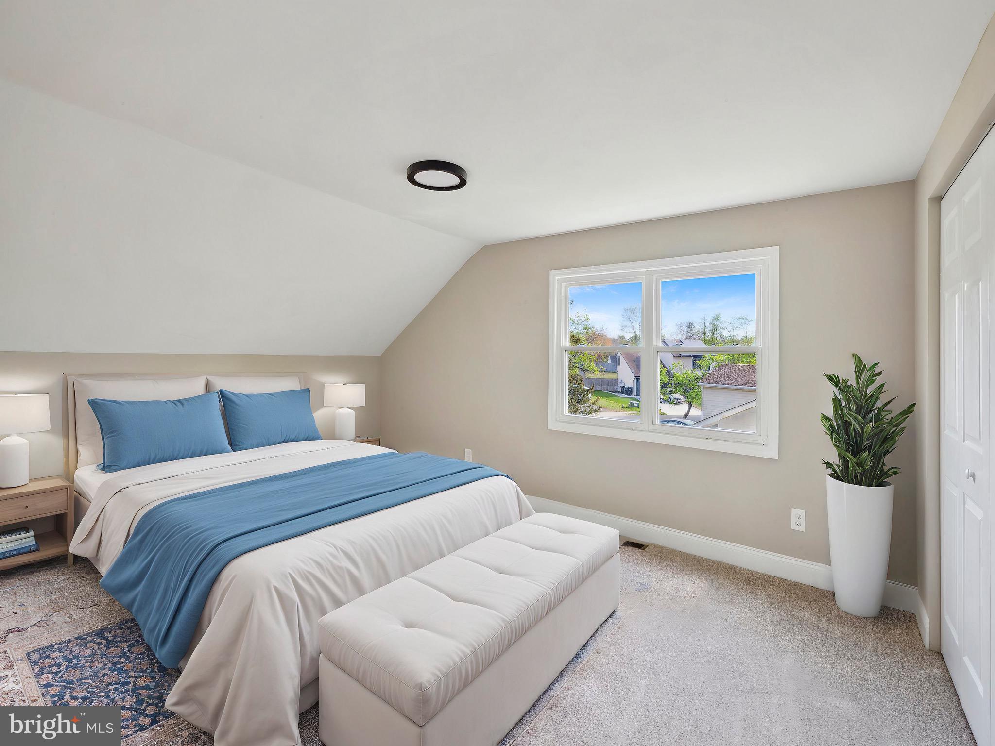 44 Pershing Lane Sicklerville, NJ 08081 - Photo 16 of 24 a bedroom with a bed and a potted plant