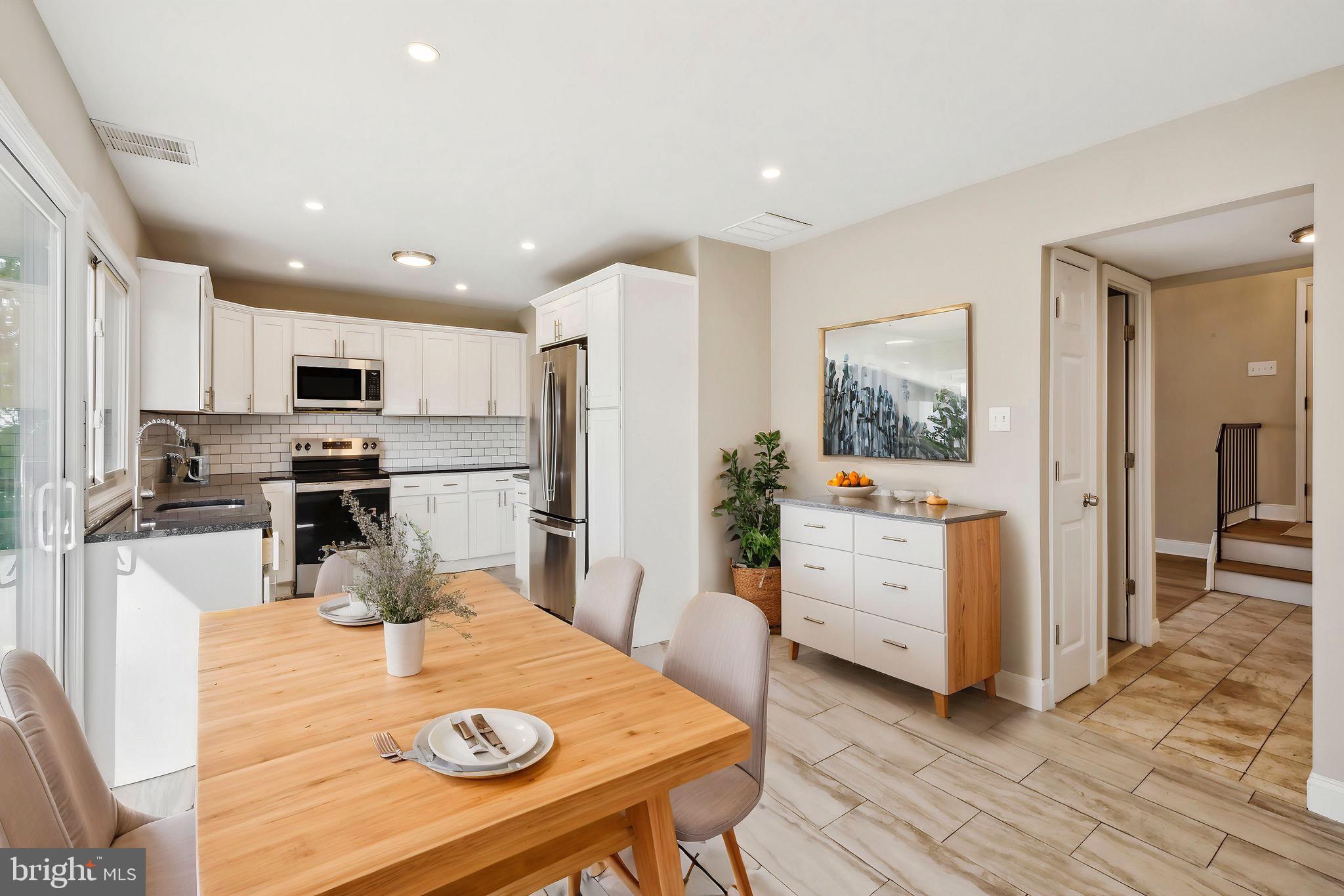 44 Pershing Lane Sicklerville, NJ 08081 - Photo 21 of 24 a kitchen with a refrigerator a stove cabinets and wooden floor