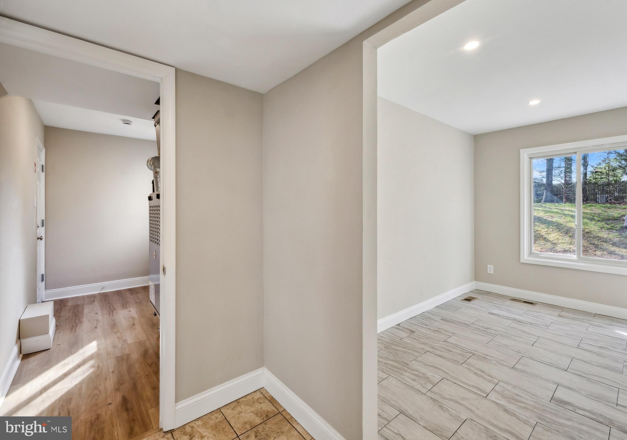 44 Pershing Lane Sicklerville, NJ 08081 - Photo 22 of 24 a view of hallway with window and wooden floor