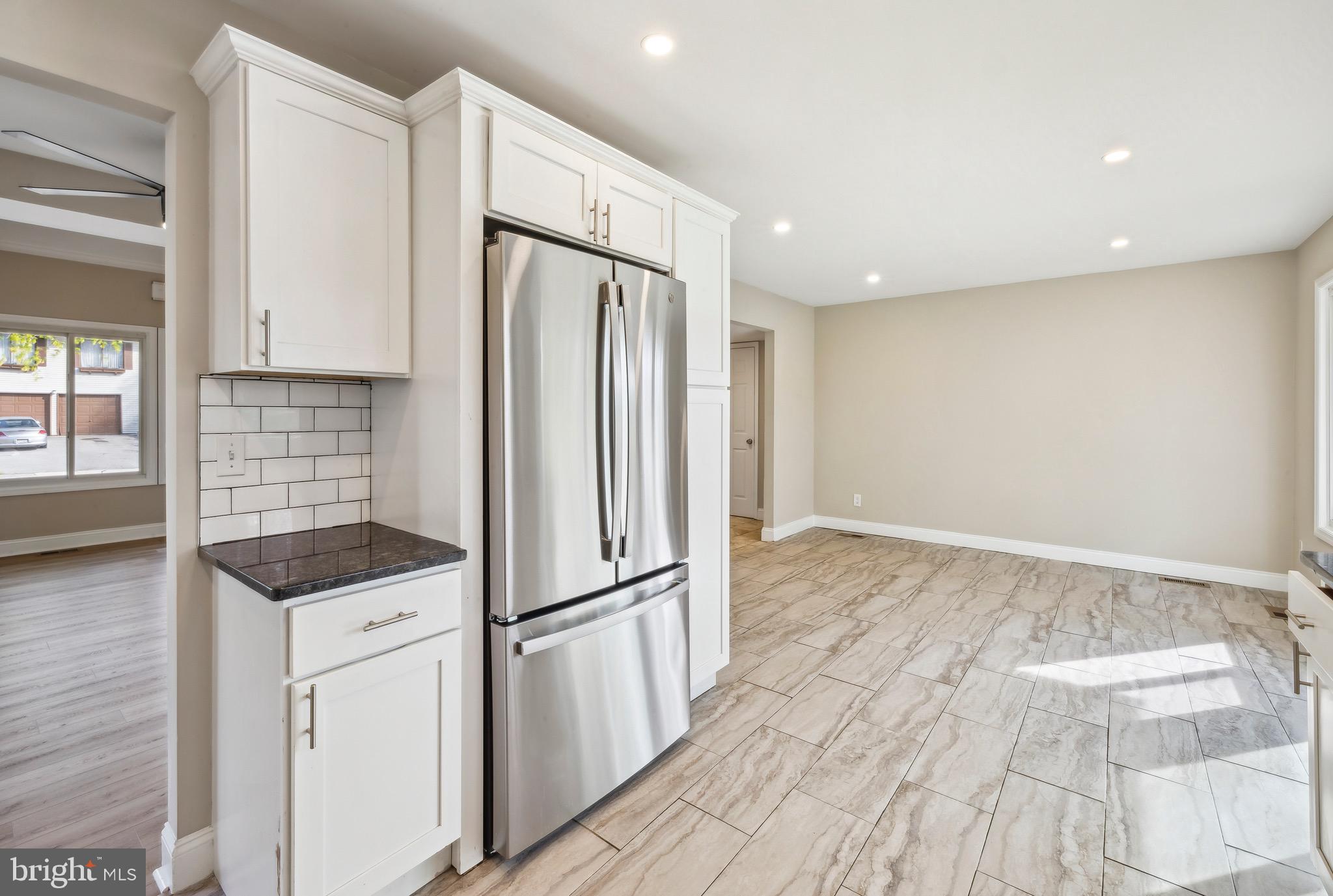 44 Pershing Lane Sicklerville, NJ 08081 - Photo 4 of 24 a kitchen with a refrigerator and cabinets