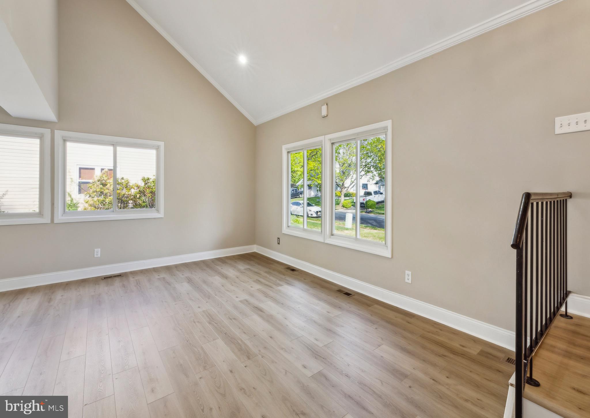 44 Pershing Lane Sicklerville, NJ 08081 - Photo 8 of 24 a view of an empty room with wooden floor and a window