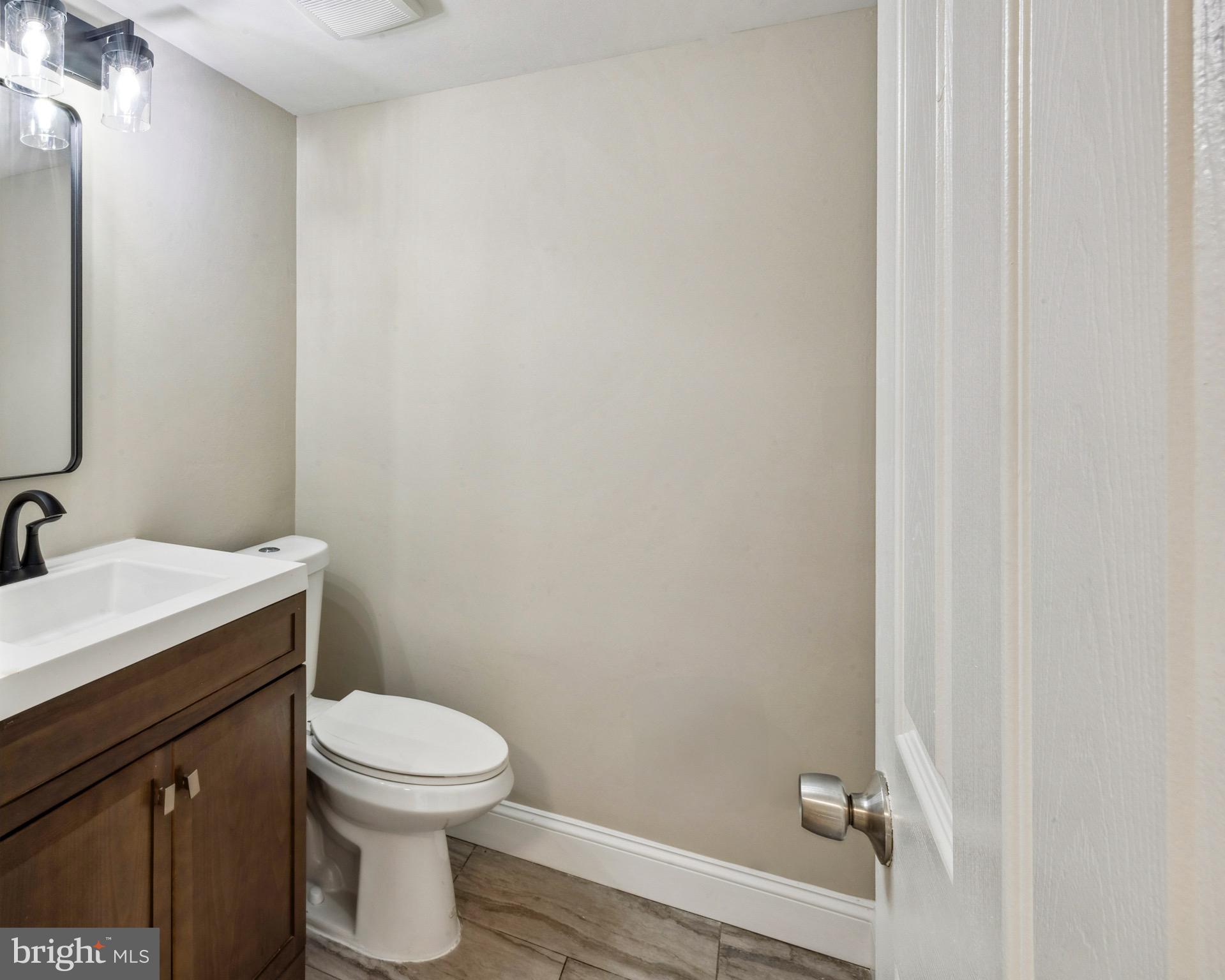 44 Pershing Lane Sicklerville, NJ 08081 - Photo 10 of 24 a bathroom with a toilet a sink and vanity