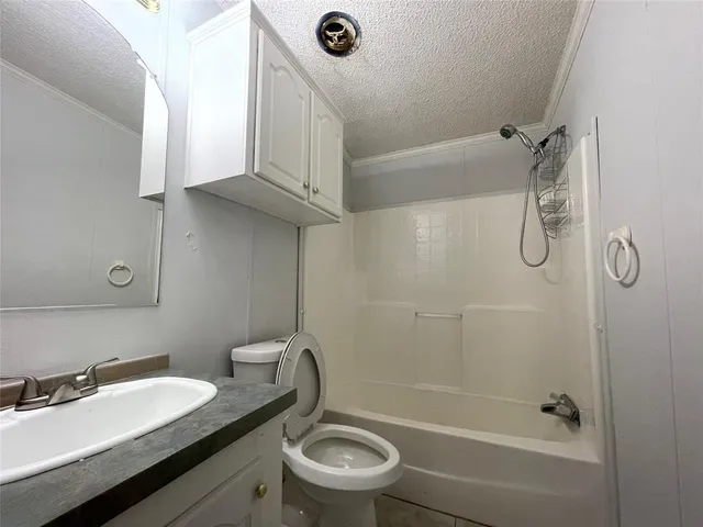 a bathroom with a bathtub and a sink