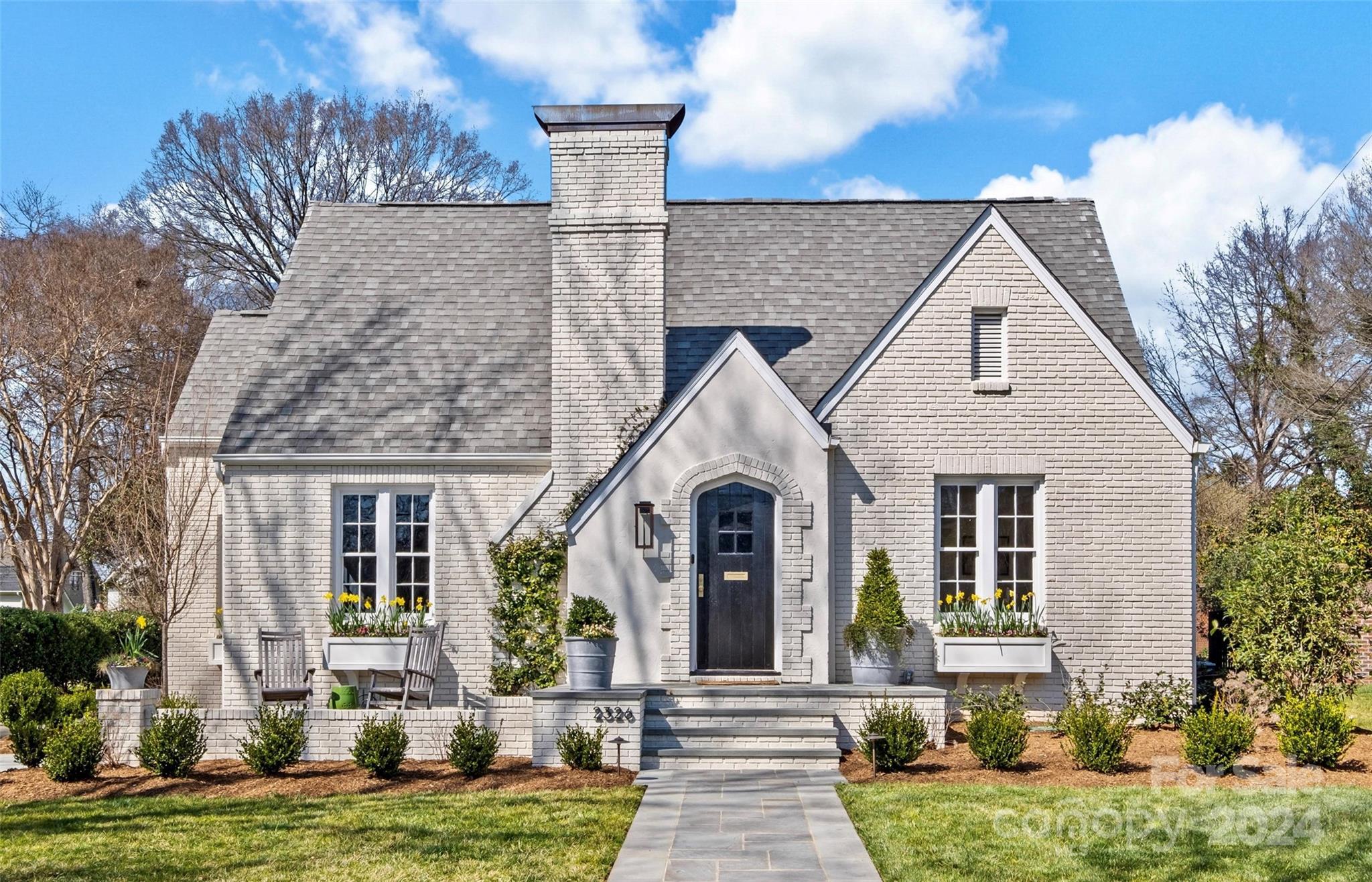 a front view of a house with a yard