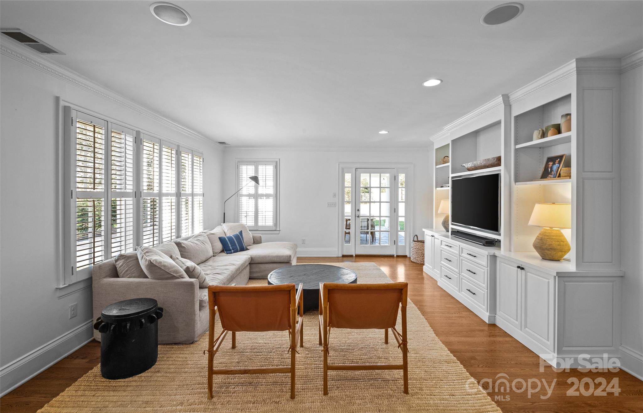 2326 Croydon Road Charlotte, NC 28207 - Photo 14 of 44 a living room with furniture a flat screen tv and a large window