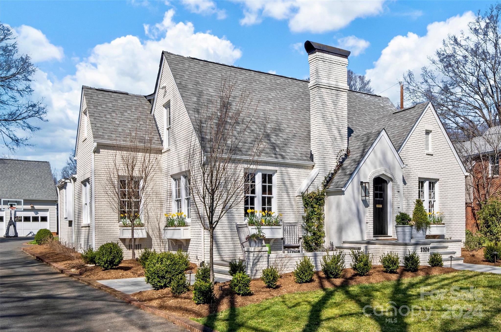 2326 Croydon Road Charlotte, NC 28207 - Photo 2 of 44 front view of a house with a fountain
