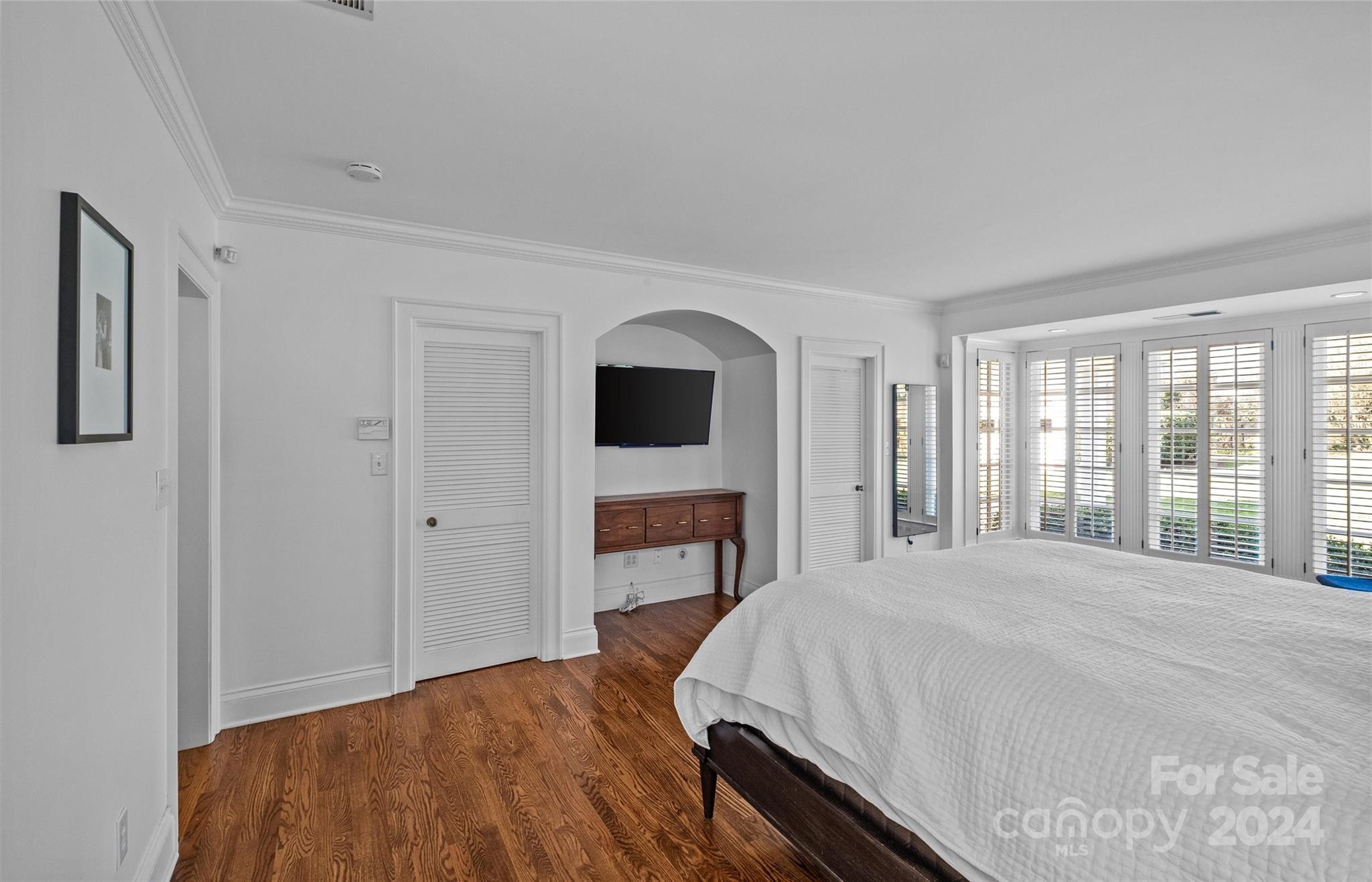 2326 Croydon Road Charlotte, NC 28207 - Photo 22 of 44 a bedroom with a large bed and a tv