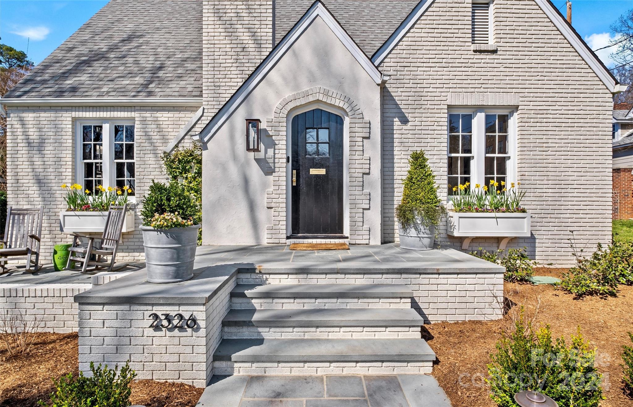2326 Croydon Road Charlotte, NC 28207 - Photo 3 of 44 a front view of a house with garden