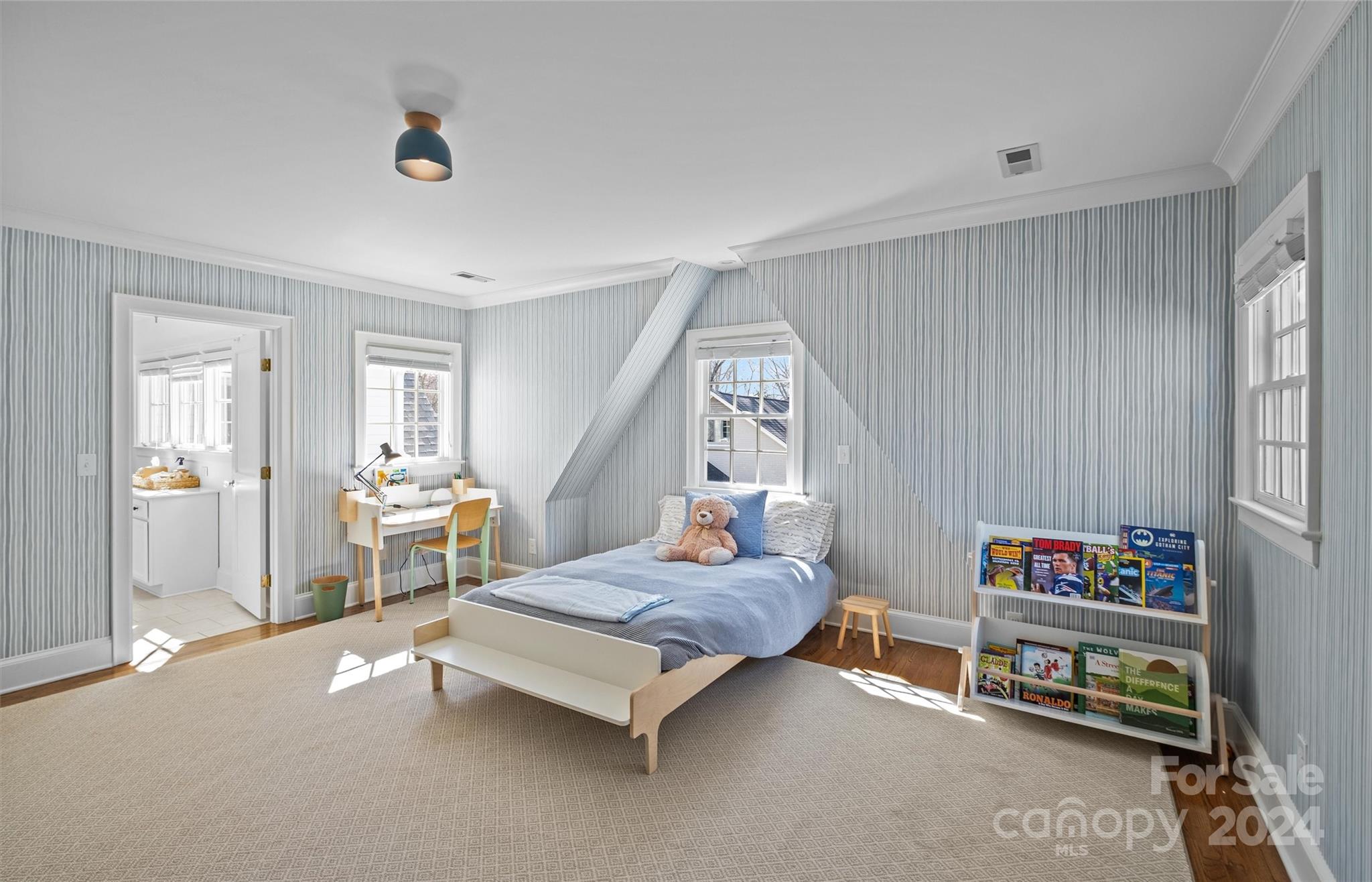 2326 Croydon Road Charlotte, NC 28207 - Photo 31 of 44 a bedroom with furniture and a book shelf