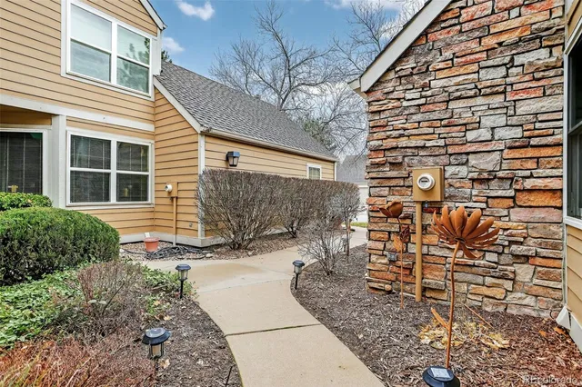 a backyard of a house with outdoor seating