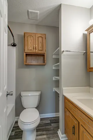 a bathroom with a toilet sink and a shower