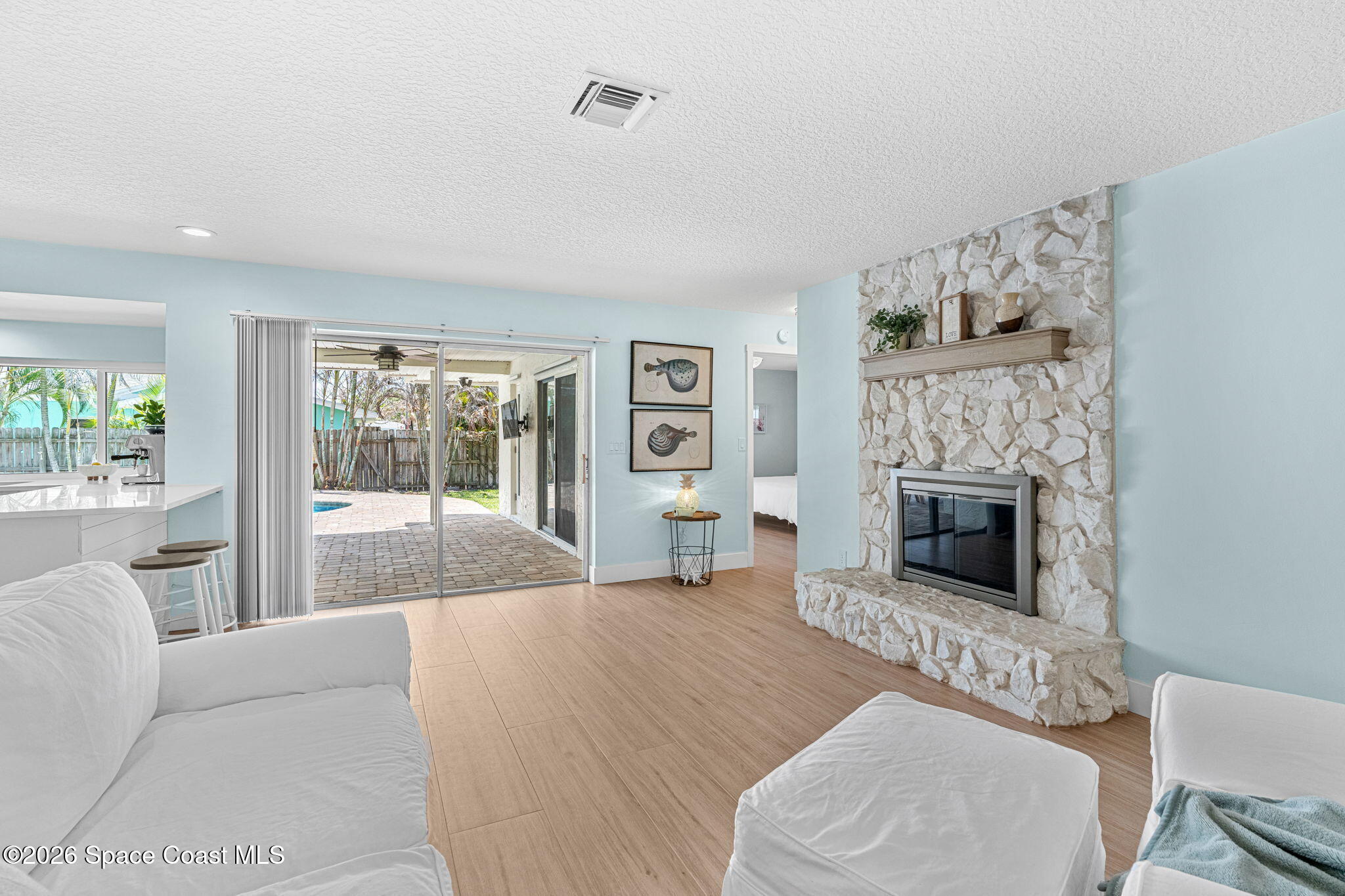 429 Rio Lane Indialantic, FL 32903 - Photo 11 of 50 a living room with furniture and a fireplace