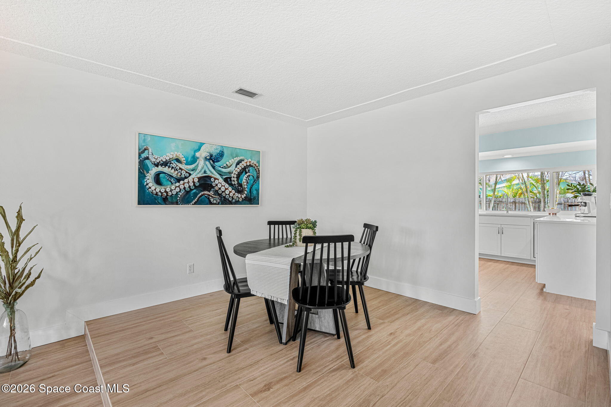 429 Rio Lane Indialantic, FL 32903 - Photo 12 of 50 a view of a dining room with furniture and wooden floor