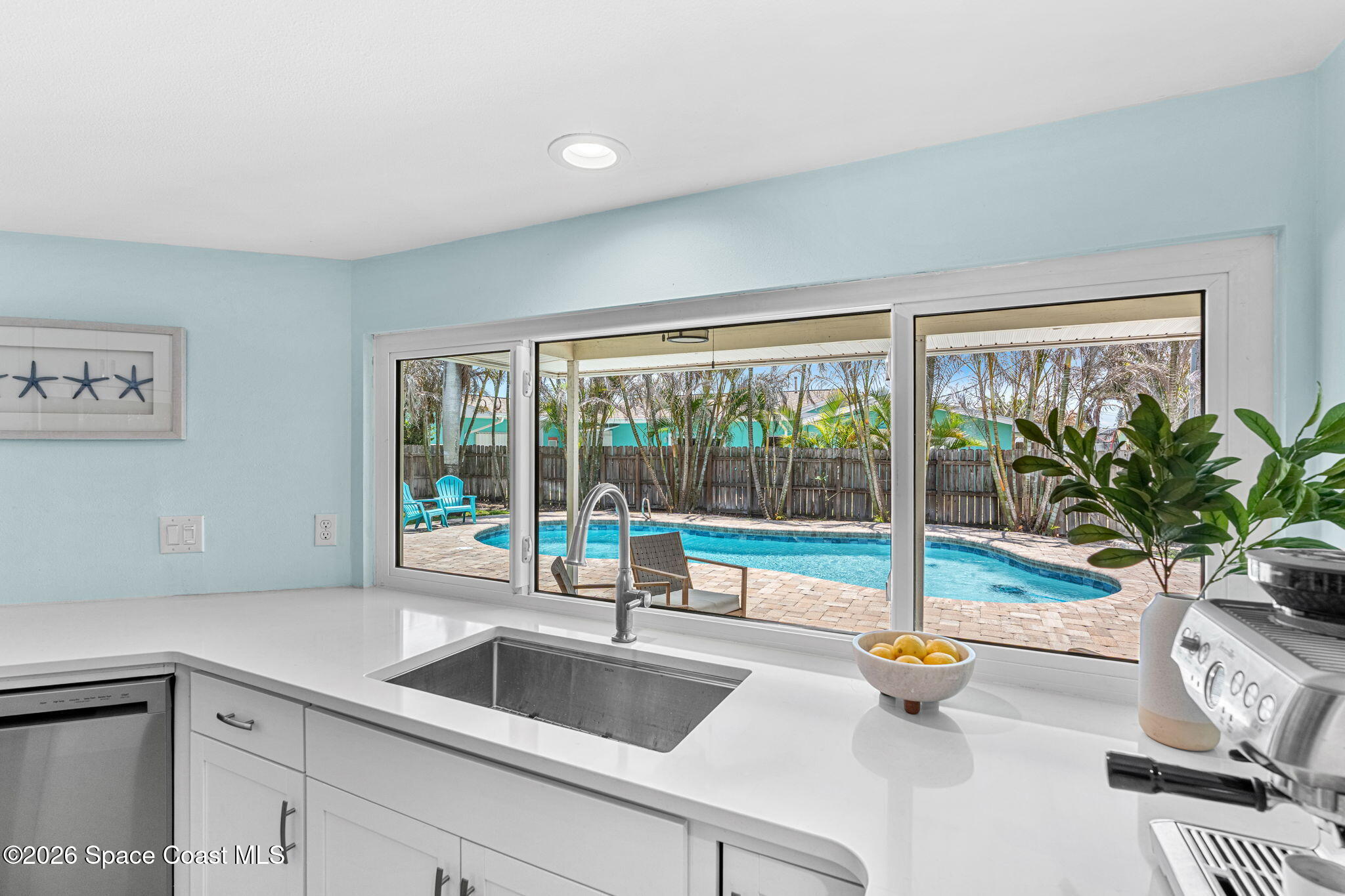 429 Rio Lane Indialantic, FL 32903 - Photo 15 of 50 a kitchen with a sink and a window