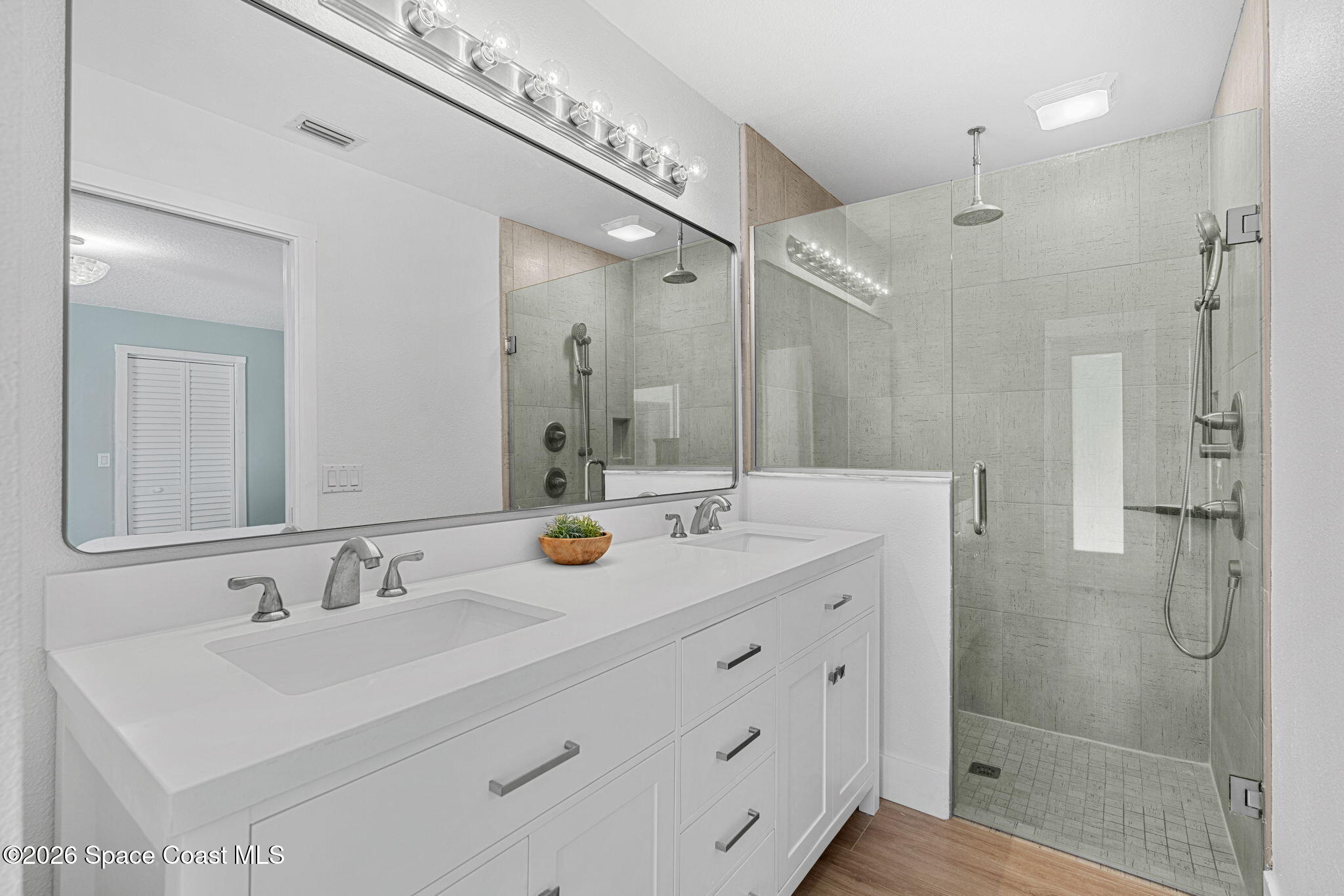 429 Rio Lane Indialantic, FL 32903 - Photo 23 of 50 a bathroom with a sink double vanity and shower