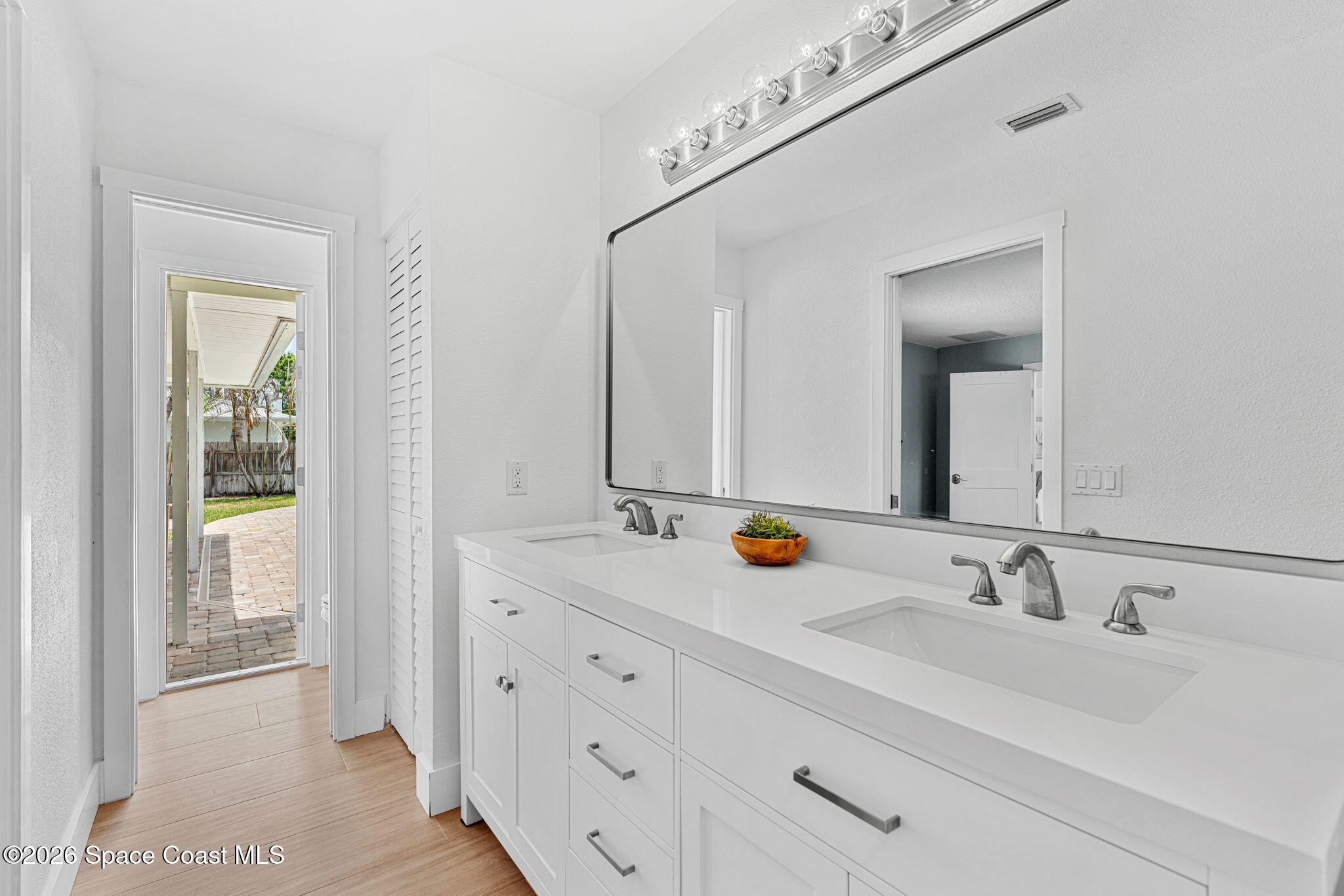 429 Rio Lane Indialantic, FL 32903 - Photo 25 of 50 a bathroom with double sink and two mirror
