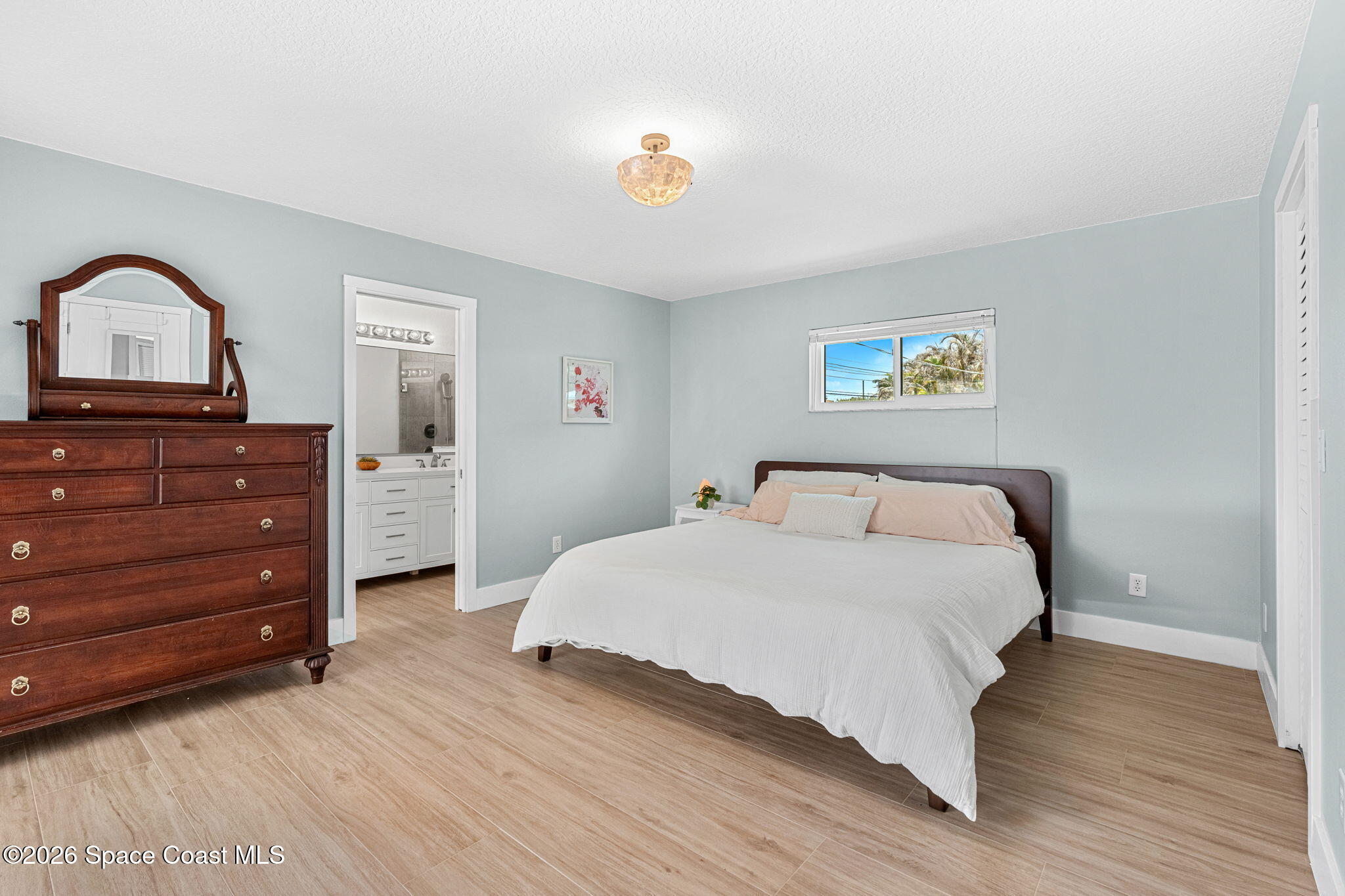 429 Rio Lane Indialantic, FL 32903 - Photo 26 of 50 a bedroom with a bed and a dresser