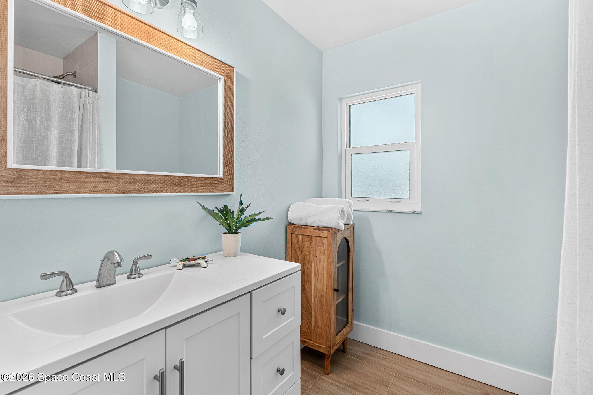 429 Rio Lane Indialantic, FL 32903 - Photo 30 of 50 a bathroom with a sink and a mirror