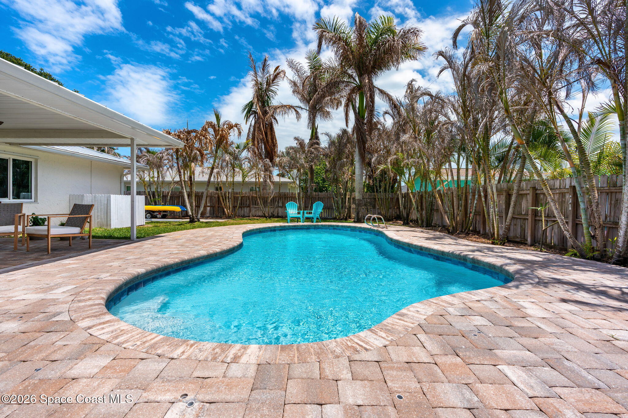 429 Rio Lane Indialantic, FL 32903 - Photo 35 of 50 a view of a swimming pool with a patio