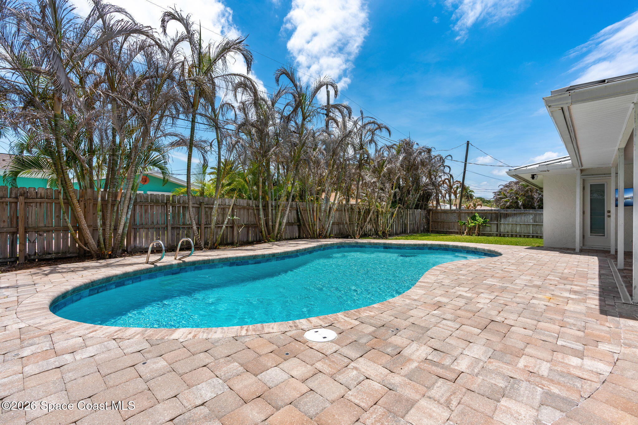 429 Rio Lane Indialantic, FL 32903 - Photo 37 of 50 a view of a backyard with wooden fence