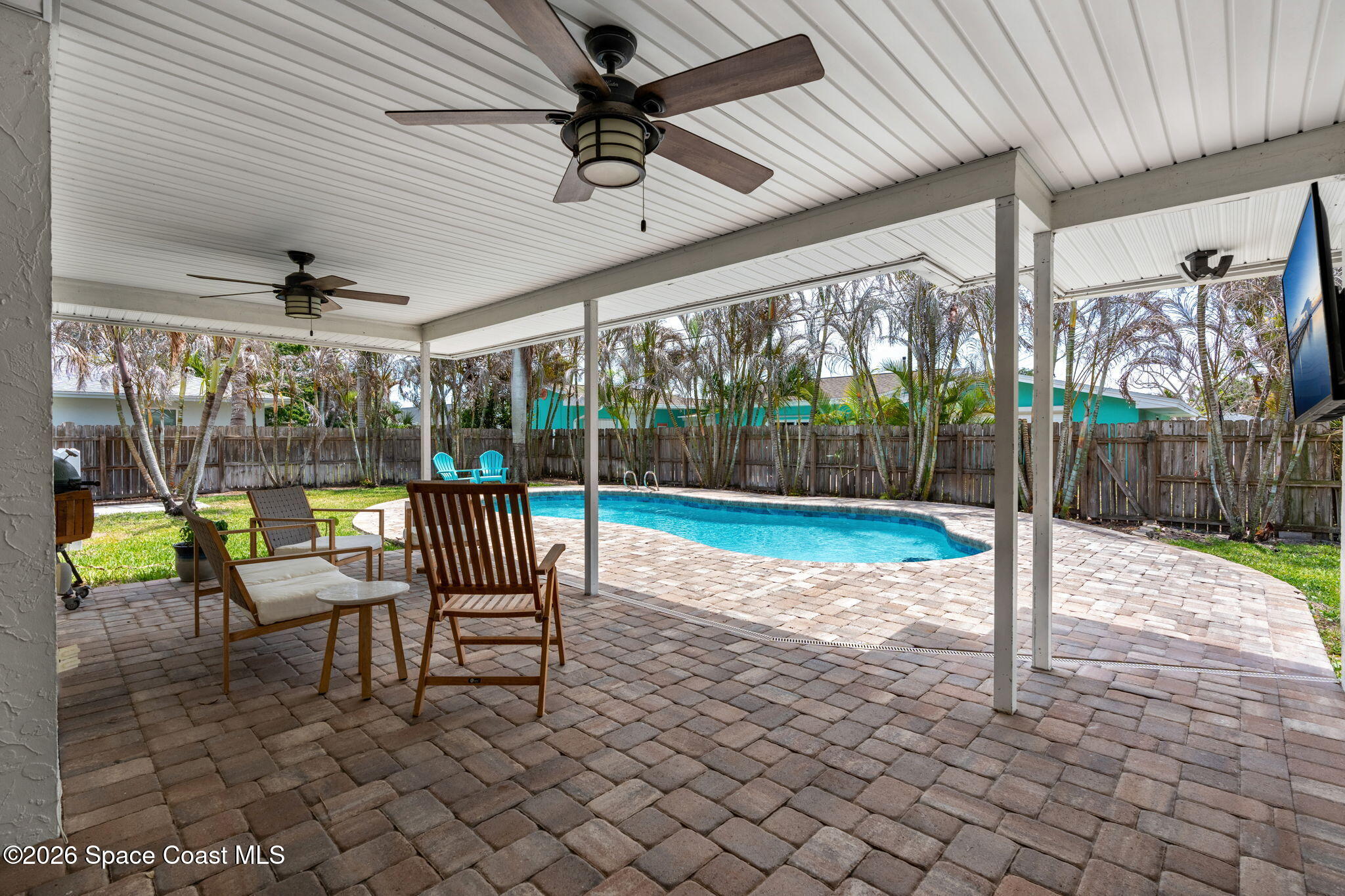 429 Rio Lane Indialantic, FL 32903 - Photo 41 of 50 a view of a patio with a table chairs and backyard