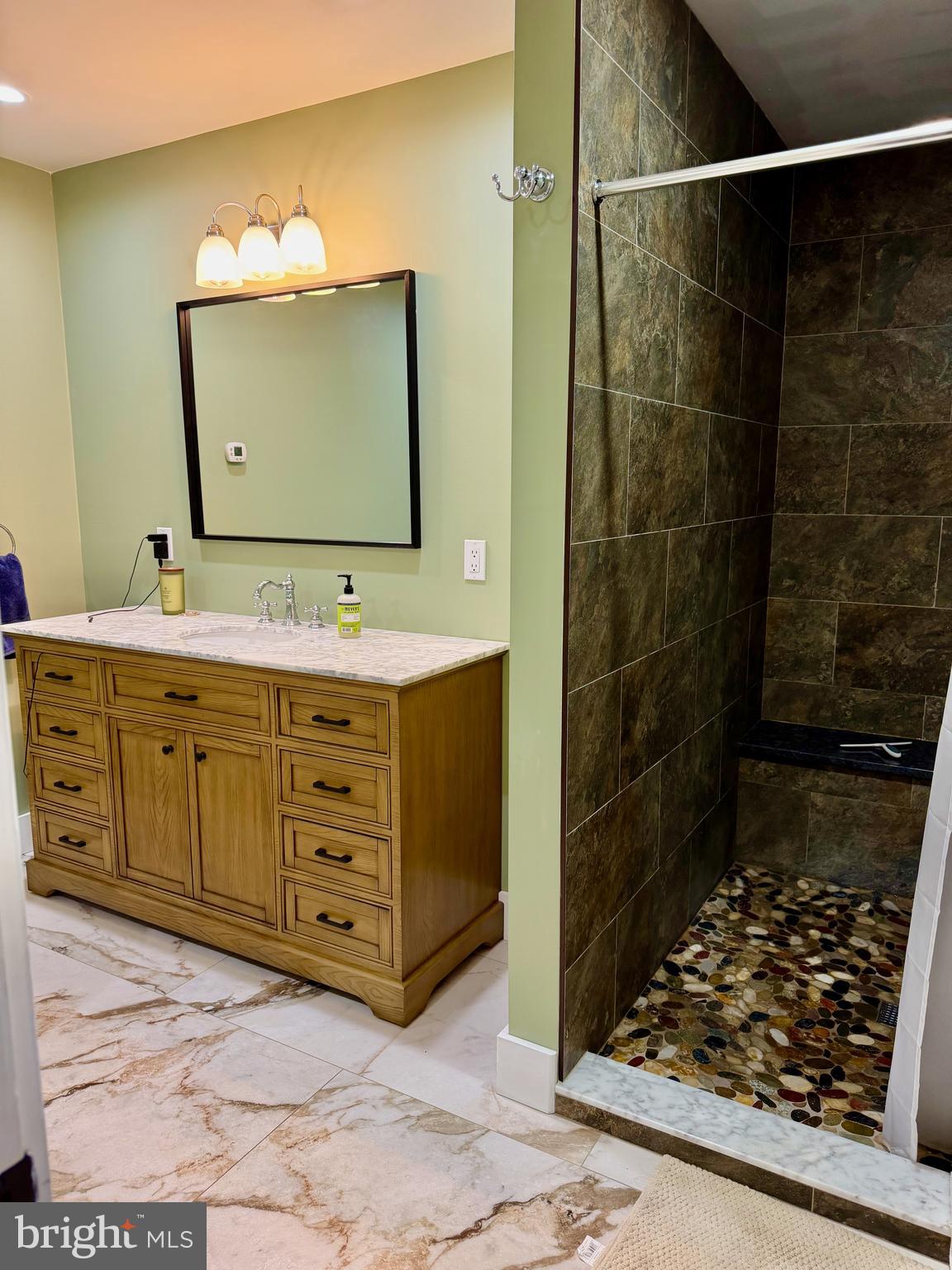 943 Sackettsford Road Warminster, PA 18974 - Photo 11 of 28 a bathroom with a sink and a mirror