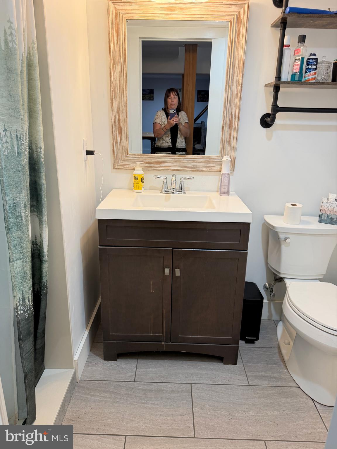 943 Sackettsford Road Warminster, PA 18974 - Photo 17 of 28 a bathroom with a sink a toilet and a mirror