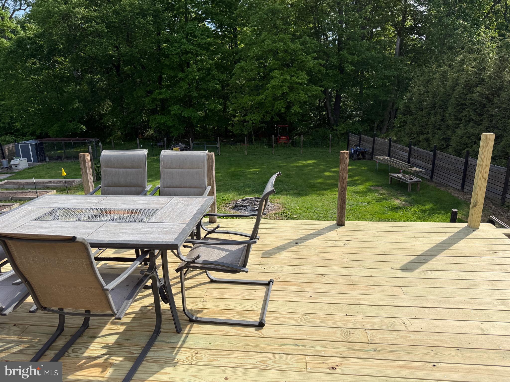 943 Sackettsford Road Warminster, PA 18974 - Photo 23 of 28 a roof deck with table and chairs a barbeque