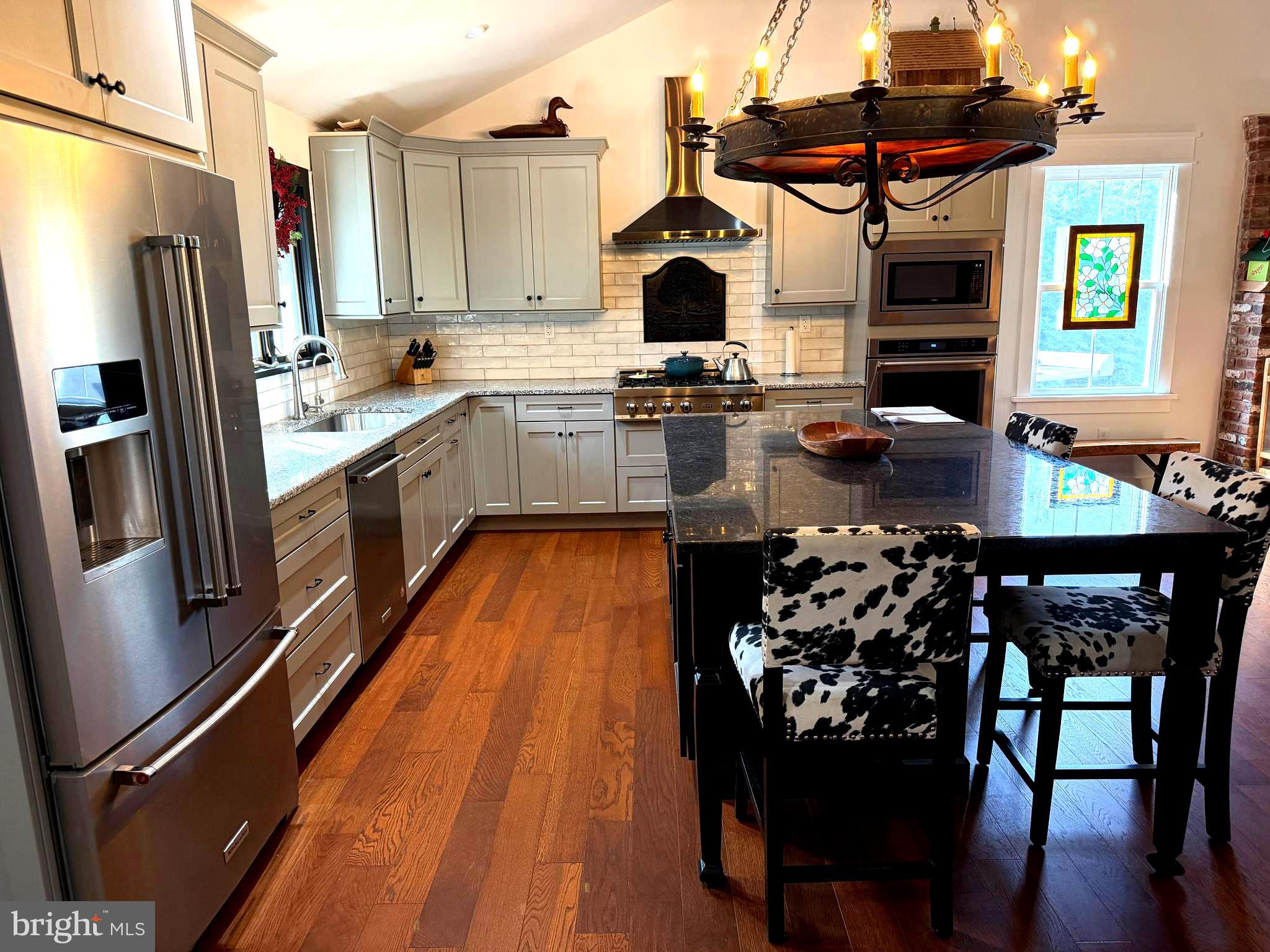 943 Sackettsford Road Warminster, PA 18974 - Photo 6 of 28 a kitchen with stainless steel appliances kitchen island granite countertop a stove refrigerator and cabinets