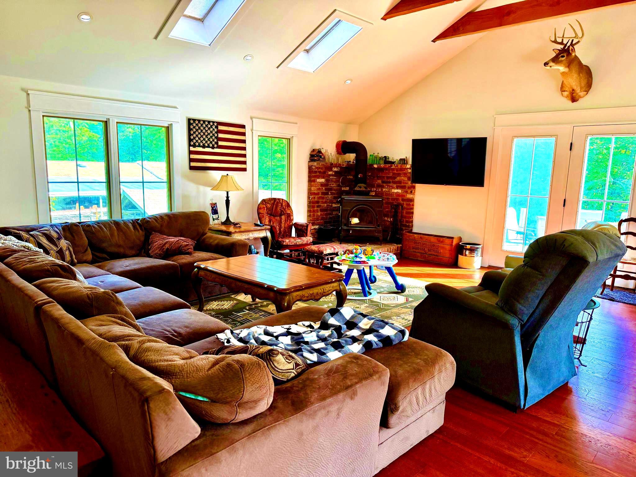 943 Sackettsford Road Warminster, PA 18974 - Photo 8 of 28 a living room with furniture and a flat screen tv