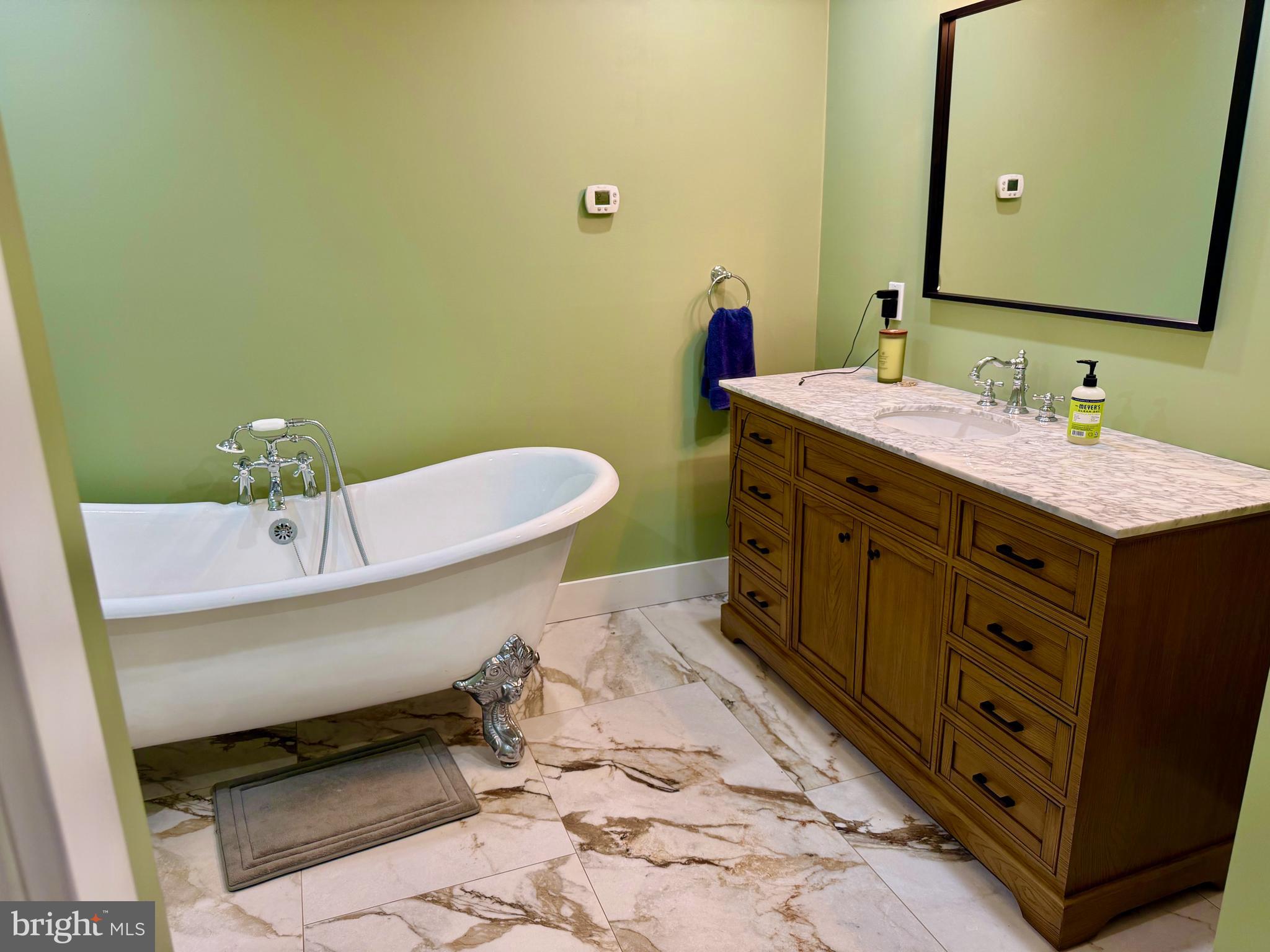 943 Sackettsford Road Warminster, PA 18974 - Photo 10 of 28 a bathroom with a sink a toilet and mirror