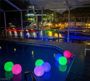 a view of a chair and tables in the patio