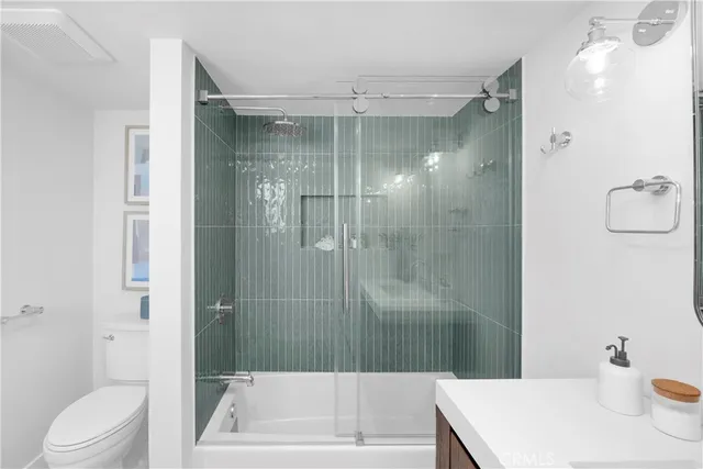 a bathroom with a shower and a toilet