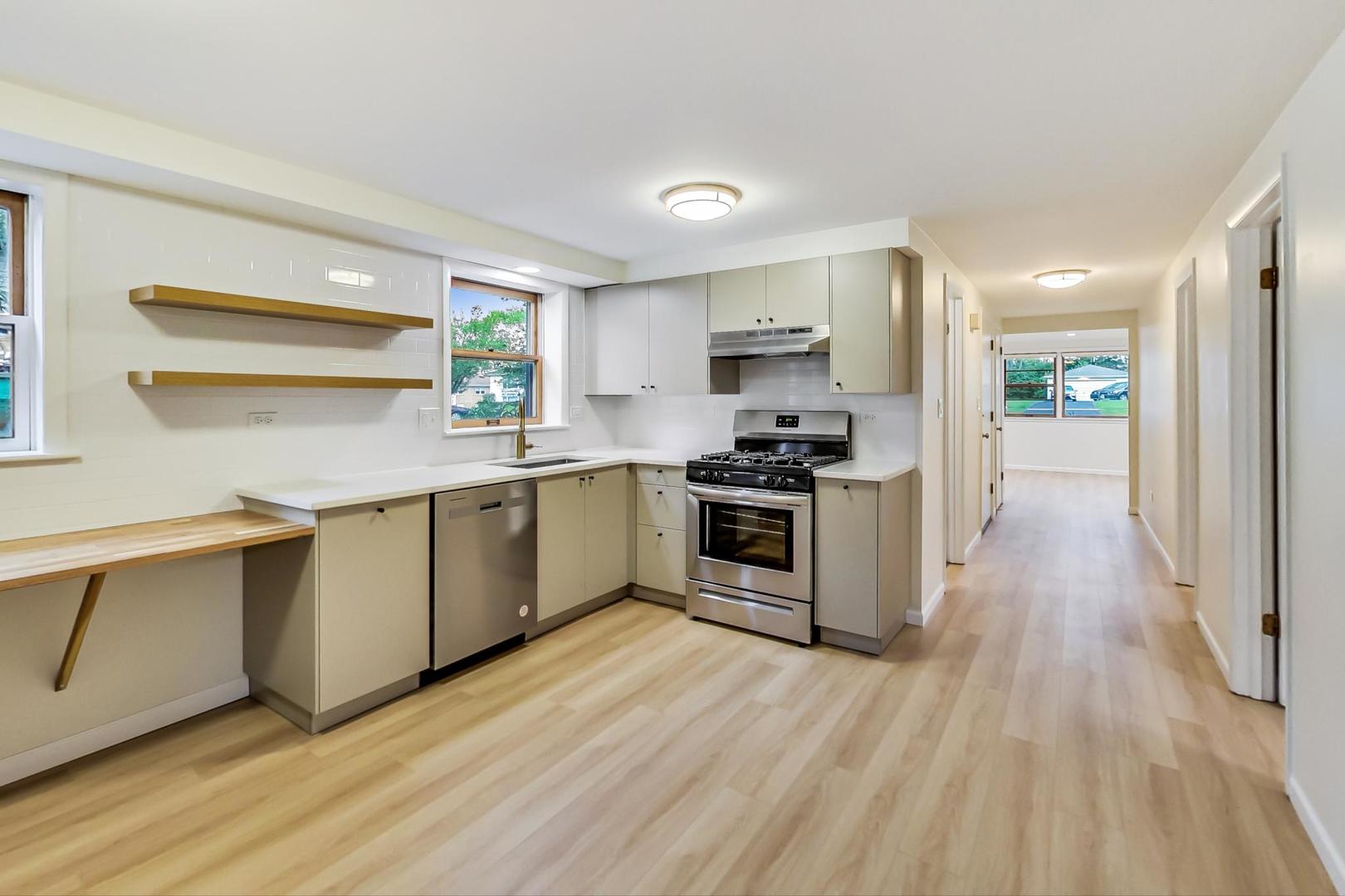 16W674 56th Place Clarendon Hills, IL 60514 - Photo 25 of 41 a kitchen with a sink cabinets stainless steel appliances and window