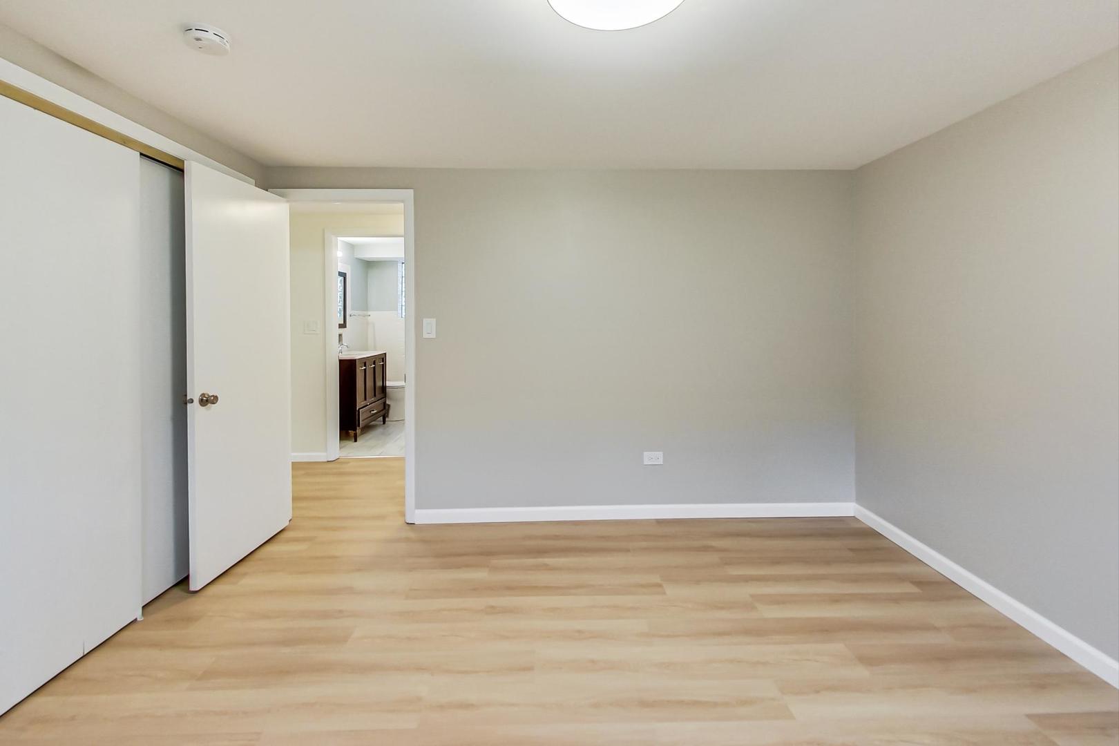 16W674 56th Place Clarendon Hills, IL 60514 - Photo 29 of 41 a view of an empty room with wooden floor