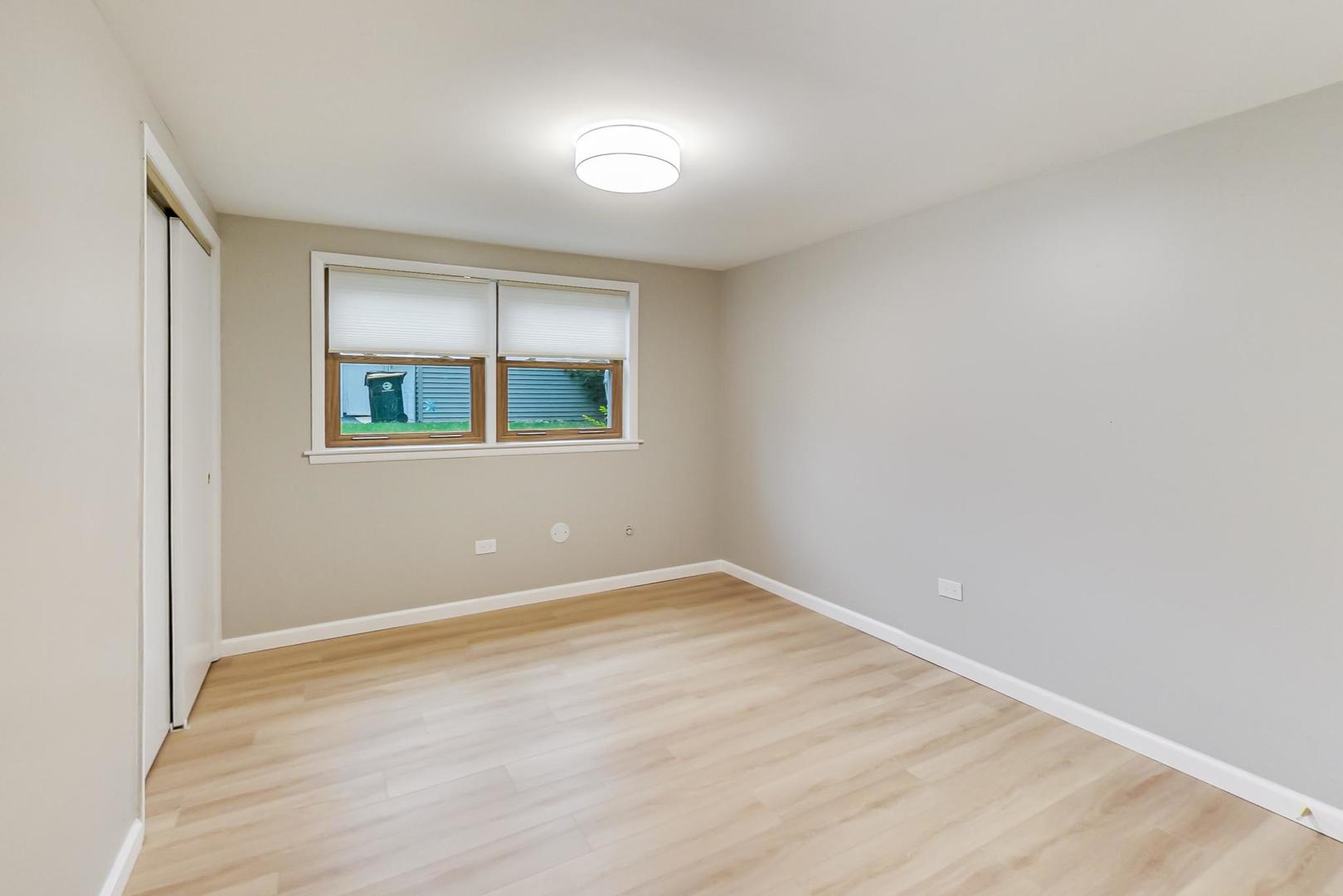 16W674 56th Place Clarendon Hills, IL 60514 - Photo 32 of 41 an empty room with a window