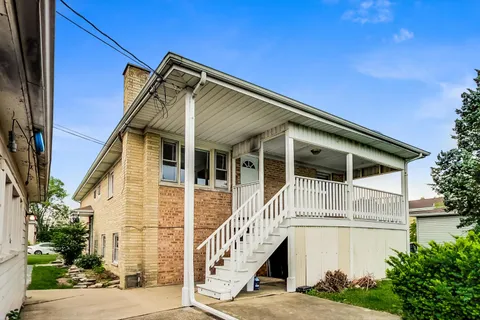 a front view of a house with a balcony